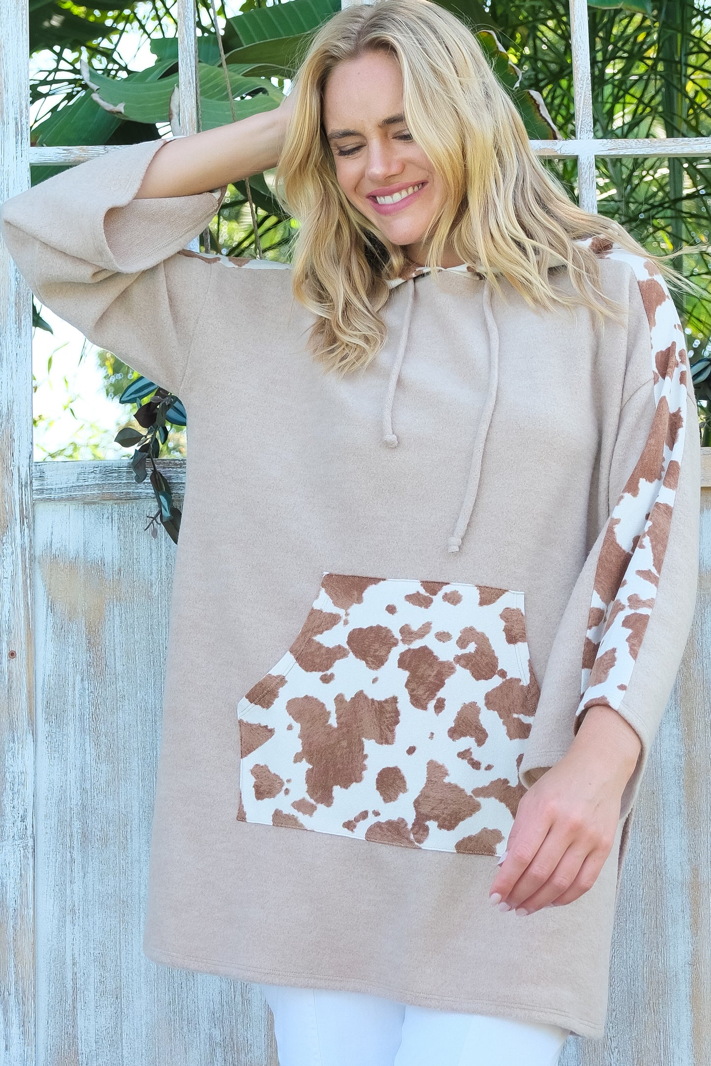 Cozy Beige Cow Print Accent Hoodie with Front Pocket